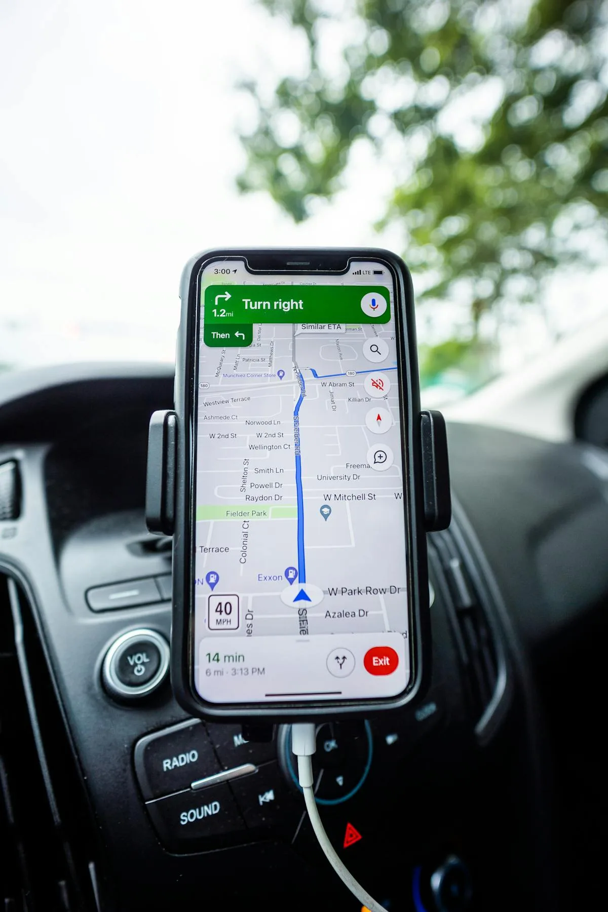 Smartphone mounted in car showing GPS navigation — how Android records location metadata in photos